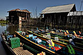 Inle Lake Myanmar. All the buildings are constructed on piles. Residents travel around by canoe, but there are also bamboo walkways and bridges over the canals, monasteries and stupas. 